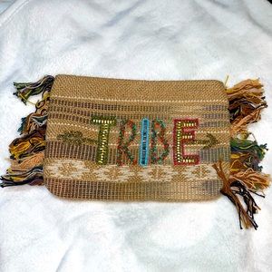 Woven “Tribe” clutch with beaded detail and front.